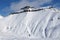 Skiers and off-piste slope with traces of skis, snowboards and a