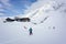 Skiers performing a group check of avalanche beacons