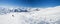 Skiers on a piste in alpine ski resort