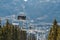 Skiers riding on ski lift in Whistler, Canada