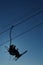 Skiers silhouette on cableway
