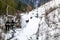 Skiers on ski lift to mountain Zakhar Berkut, Carpathian mountains in Slavske, Ukraine