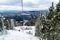 Skiers on ski lift to mountain Zakhar Berkut, Carpathian mountains in Slavske, Ukraine on January 1