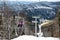 Skiers on ski lift to mountain Zakhar Berkut, Carpathian mountains in Slavske, Ukraine on January 1