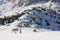Skiers on ski lifts in Val Gardena Ski resort, Sellaronda
