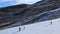 Skiers on a Slope with Artificial Snow