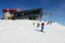 The skiers are on slope near cableway station on Chopok in Jasna Low Tatras, Slovakia