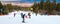 Skiers on the slope , ski lift, mountains view and Bansko panorama, Bulgaria