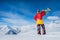 skiers stand in the background of snow mountains. man and gi