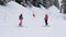 Skiers Standing On The Slope Show Each Other The Route Where To Skiing