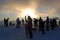 skiers on the summit at sunset