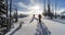 Skiers walking through fresh powder