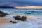 Skies on fire at sunset, with the rain in the background in North Shore in Oahu, Hawaii