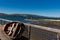 Skiff leaning on a dock rail over looking Tomales Bay