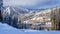 Skiing down to the village of Sun Peaks in a Winter Landscape