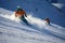 Skiing enthusiasts in the picturesque Alpine mountains, surrounded by snow