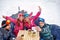 Skiing family enjoying in winter vacation on snow and making selfie