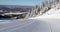 Skiing First Tracks. Closeup of perfect groomed alpine skiing piste trail slope. Fresh Track Ski concept.Skiing on snow