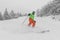 Skiing. Man on ski in Alpine ski concept - Skier skiing downhill doing hockey stop at mountain snow covered ski trail