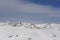 Skiing resort in Grandvalira in Pyrenees mountain range in Andorra with snow on a sunny winter day