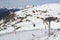 Skiing resort in Grandvalira in Pyrenees mountain range in Andorra with snow on a sunny winter day