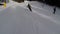 Skiing skiers on the piste in Bukovel ski resort, Ukraine