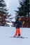 Skiing in the snow. One Asian child skier on the ski slope. Vacation in Switzerland