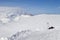 Skiing and snowboarding equipment on slope at sunny day