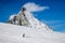 skiing under Matterhorn peak against blue sky Swiss Alps