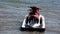 Skiing on water scooter. personal watercraft in tropical sea. Active summer vacation for school child. Sport and ocean