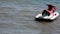 Skiing on water scooter. personal watercraft in tropical sea. Active summer vacation for school child. Sport and ocean