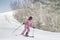 Skiing - Woman on ski. Alpine ski concept - skier skiing downhill at mountain snow covered ski trail slopes in winter on