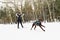 A skijoring woman have fun in forest