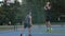 Skilful guy basketball player in uniform, dribbles the ball, passes the opponent`s defender and completes the attack by