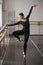 Skill ballerina posing in ballet class