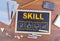 Skill Business concept. Chalkboard on wooden office desk