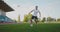 Skill professional soccer player a man runs in with a soccer ball on a soccer field in a stadium demonstrating excellent