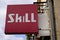 Skill sign and text red logo front of local fashion shop shoes and store footwear