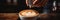 Skilled barista pouring heart-shaped cappuccino. Artistic capture of cozy coffee shop ambiance