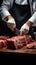 Skilled butcher cuts meat, frontal view, against a dark surface, showcasing precision