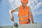 Skilled Caucasian bricklayer working with a hammer