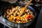 skilled chef preparing a classic French ratatouille salad in a sizzling frying pan.