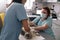 Skilled doctor performs ultrasound investigation while assistant holds animal in vet clinic