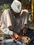 Skilled hands using needal & working on  roadside shoe repairer in Kalyan