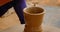 Skilled potter hands shaping the clay on potter wheel. Pot throwing handicraft bowl, jar, pot, jug. Rajasthan, India