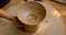 Skilled potter hands shaping the clay on potter wheel. Pot throwing handicraft bowl, jar, pot, jug. Rajasthan, India