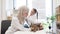 Skilled veterinary examining pet with little girl in clinic