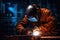 A skilled welder is seen working on a piece of metal inside a bustling factory, Welder in welding helmet working on metal with
