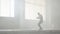 Skillful young great hip-hop dancer performing in the fog. Hip hop culture. Rehearsal. Contemporary.