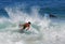 Skim boarder blasting a wave at Brooks Street Beach, Laguna Beach, CA.